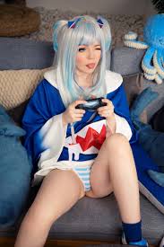 caticornplay, gawr gura, hololive, hololive english, real life, absurdres,  cosplay photo, highres, photo (medium), tagme, 1girl, blue eyes, blue hair,  controller, cosplay, dualshock, female focus, game controller, gamepad,  gawr gura (cosplay), knees, one eye ...