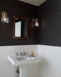 Chic Black And White Bathroom Boasts Crate Barrel Lander Brass Sconces Mounted On Black Grasscloth Wallpaper On Either Side Of A Wood Fr Bathrooms