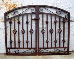The metalwork is fashioned to resemble maybe mountains or a desert this sliding gate has been painted a gorgeous, bold color. Wrought Iron Gate Gallery