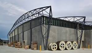 The Roof Made From Colorbond Steel Is Suspended Below The Curving Roof Trusses Which Reduced The External Wall Area By About 900m2 To Achieve Significant Cost