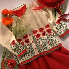 Un Gilet De Petite Fille Orne De Coquelicots Modele Tricot Enfant Modele Tricot Bebe Tricot