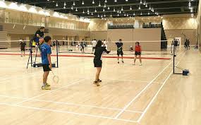 The net divides the court into two halves. Badminton Hall Booking
