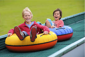 Just below the pool is a popular summer spot for swimming and sunning on the rocks. Summer Tubing And Outdoor Roller Skating Beech Mountain Resort