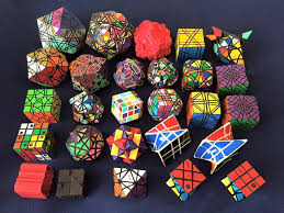a photo of the puzzles i designed that i still have my own copy of gosh i really need to sticker a radio cube 3 for rubiks cube cube rubiks cube algorithms