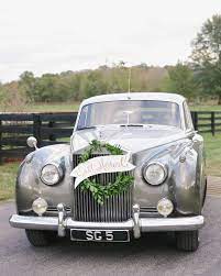 28 Ideas That Prove Wreaths Aren T Just For Christmas Wedding Wreaths Just Married Sign Wedding Car Decorations