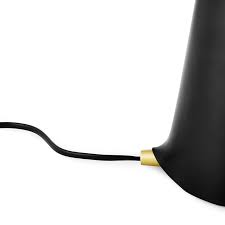 Shelter is a simple, characterful lamp that emits a cozy light onto its surroundings. Shelter Table Lamp Black Normann Copenhagen
