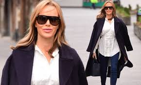 The radio host and presenter, 49, boosted her height with black stilettos as she departed the global radio building and sashayed through leicester square. Amanda Holden Looks Chic In A Stylish Winter Coat And Skinny Form Fitting Jeans Daily Mail Online