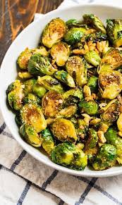 Oven Roasted Brussels Sprouts With Garlic And Paremsan Are The Best Easiest Most Delici Sprout Recipes Roasted Brussel Sprouts Brussel Sprout Recipes Roasted
