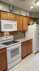 oak cabinets with white appliances