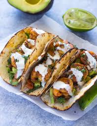 Spicy Shrimp Tacos With Avocado Salsa Sour Cream Cilantro Sauce Gimme Delicious