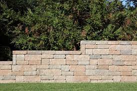 This design causes the wall to angle slightly back into the slope, further improving its holding. How To Build A Retaining Wall With Blocks