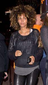 She wore long wavy hair that were said to be one of her most feminine appearance. Halle Berry Steps Out With A Bold New Look In Los Angeles Vogue