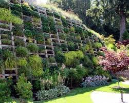79 Ideas To Build A Retaining Wall In The Garden Slope Protection And Catchy Slope Landscaping Sloped Garden Steep Slope Landscaping