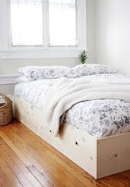 The front frame uses 2x6s at the top and bottom, 2x4s on the inside and 1x4s on the outside edge. Diy Simple Bedframe Themerrythought Simple Yet Elegant Way To Hide The Box Spring Did I Mention Its Budget Friend Simple Bed Frame Simple Bed Simple Bedframe