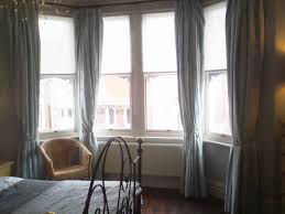 Try to treat your room window to make it more beautiful. How I Dressed My Own Bay Windows Louise Misell Interiors