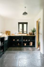 The Worn Grey Limestone By Floors Of Stone Works So Perfectly In This Stylish Devol Kitchen Slate Kitchen Kitchen Flooring Stone Flooring