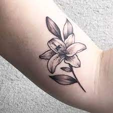 This tattoo design can easily be inked on your finger, wrist, shoulder, neck, or behind your ear. 27 Gorgeous Lily Tattoos That Stand Out Styleoholic