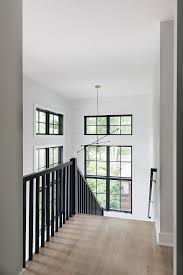 We did not find results for: Modern Farmhouse Stairway The Combination Of Black Railings Black Windows A Modern Black And Brass Chandelie Farmhouse Interior Modern Staircase House Stairs