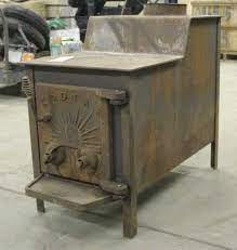 Photo is not actual stove but is same model and in good condition. Kodiak Woodstove Smith Sales Llc