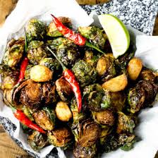 After reading all the reviews, i only cleaned my brussel sprouts and scored the stems to allow stem in. Coconut Oil Fried Brussels Sprouts W Garlic Chilies And Lime