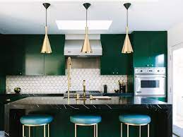 Open shelving is on both sides of the gas burning stove. Kitchens With Black Marble Apartment Therapy