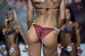 Fitness Bikini Athlete's Butt. Sexy Woman Poses On Stage. Women Like  Competing Too. Fit And Sexy. Stock Photo, Picture and Royalty Free Image.  Image 55415430.