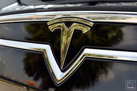 The tesla motors logo reminds me of a cross sectional view of one pole of an electric motor. Behind The Badge Does The Tesla Emblem Represent More Than The Letter T The News Wheel