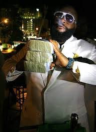 Rick Ross with money - Miami Real Estate