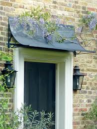 I have posted a picture of my brick home with the current awning, and another picture of the type of canopy i want. Front Door Canopy Savillefurniture