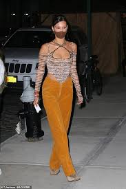 140 sets 9527 low quality photos. Bella Hadid Showcases Her Cleavage In Patterned Corset Top With Orange Trousers In Nyc Todayuknews