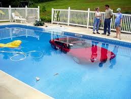 A Car Lands In A Swimming Pool To Bad For The Pool Guy Pool Swimming Pools Bad Drivers