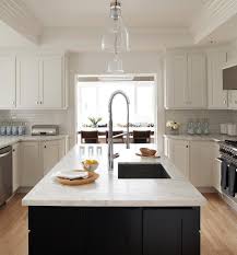 white kitchen island with grohe faucet