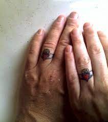 My Husband And I Got Claddagh Wedding Ring Tattoos To Celebrate Our Champagne Anniversary Tattoo Wedding Rings Wedding Band Tattoo Ring Tattoos