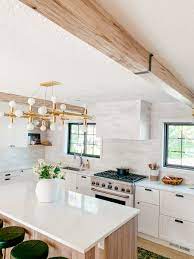 I have been wanting to add a faux beam to the bulkhead in my kitchen. How To Install Faux Wood Beams In Your Home Chris Loves Julia