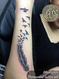Here is a beautiful feather tattoo on shoulder and you can try it on both of your shoulders. Feather Tattoo Feather Tattoo Design With Flying Birds Birds Tattoo Birds Tattoo Design With Feather Bird Tattoo Design On Side Wrist Feather Tattoo Design