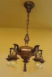 This antique and very large and substantial hanging chandelier is unsigned, but presumed to have been made in italy in circa. Vintage Lighting Antique 1920s Brass Pan Chandelier Exquisite Vintage Lighting Pendant Lights Chandeliers Brass Light Fixture