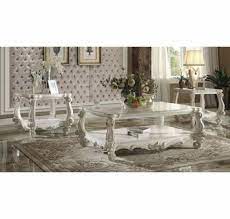 We carry a wide variety of coffee table sets that come in a variety of finishes like cherry, oak, walnut , white wash, black, white, mahogany, espresso and also carry styles that are made with both wood and metal and metal and glass and the popular marble and slat insert top, coffee, console,end. Versailles 3 Pc Bone White Wood Coffee Table Set By Acme