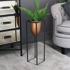 This is one of the hallways in the botanical gardens in oxford england. Tall Copper Bullet Plant Stand Windsor Browne