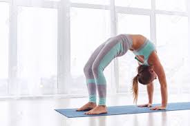Beautiful Woman Practices Backbend Yoga Asana Urdhva Dhanurasana Stock Photo Picture And Royalty Free Image Image 94232477