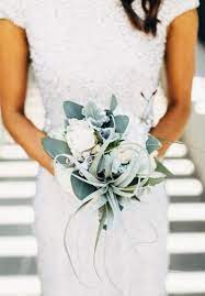I think the lillies interspersed really work well with the roses. Minimal Bridal Bouquet Arabia Weddings