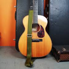 One really quick an easy way to get a strap on the guitar is to just use a shoelace or a piece of string. Acoustic Guitar Strap How To Put On Couch Guitar Straps