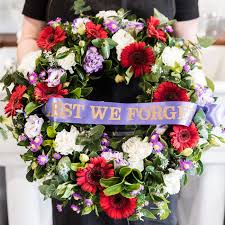 Purple Flowers On A Wreath Can Symbolise The Animal Deeds And Sacrifices Commemorating And Remembering Those Animals Floral Foam Wreath Anzac Day Poppy Wreath