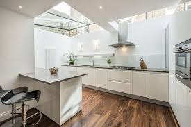 This includes doors, worktops, kitchen unit and accessories such as sinks and taps. White Gloss Kitchen With Grey Floor Novocom Top