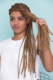 It gives an impression of the side swept look but it's nothing but a slight parting just where the braids start. 10 Super Cute Styles With Box Braids To Wear Now