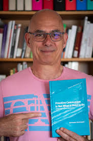 Author Christophe Darmangeat looks pleased with the copy of his recently  published book “Primitive Communism Is Not What It Used to Be: At the  Origin of Male Domination”. See all about the