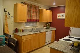 light honey oak cabinets and red wall