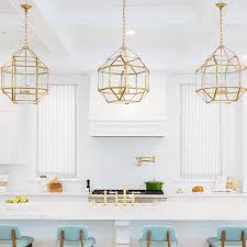 Cabinet uppers to the ceiling with the smaller, glass cubical to display whatever. Turquoise Blue Stools At White Island Transitional Kitchen