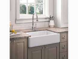 Lower the sink onto the supports and push in to ensure the apron is ﬂush to the front of the cabinet. Whitehaven Self Trimming 32 Undermount Single Bowl Sink W Tall Apron K 5827 Kohler Kohler