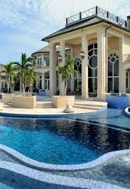 Two Story Home With All The Amenities Including A Luxurious Crystal Blue Pool And An Ambiance Mansions Luxury Homes Dream Houses Beautiful Homes