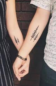 The whales have a magnet to kiss! 35 Matching Couple Tattoos To Inspire You The Trend Spotter